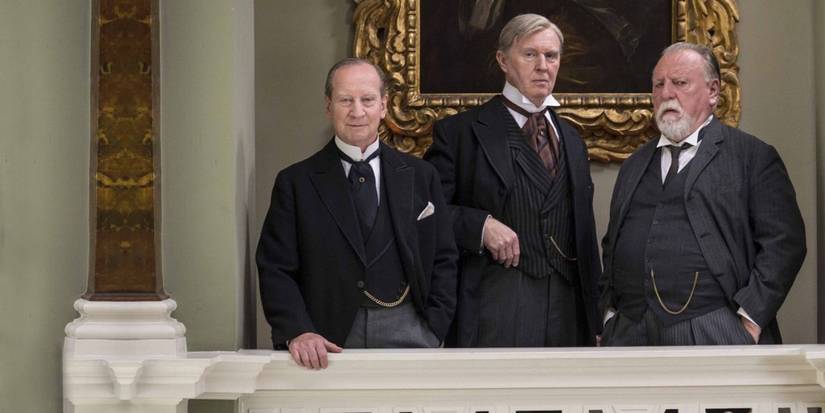 3 aristocrats confer on a balcony in '37 Days'