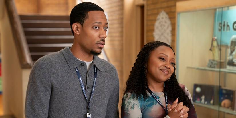 Quinta Brunson as Janine and Tyler James Williams as Gregory in the school hallway in Abbott Elementary. 