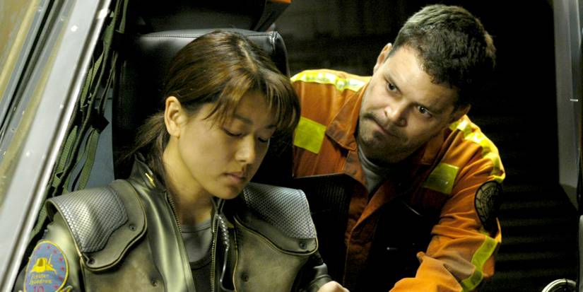 Aaron Douglas looking at Grace Park in Battlestar Galactica