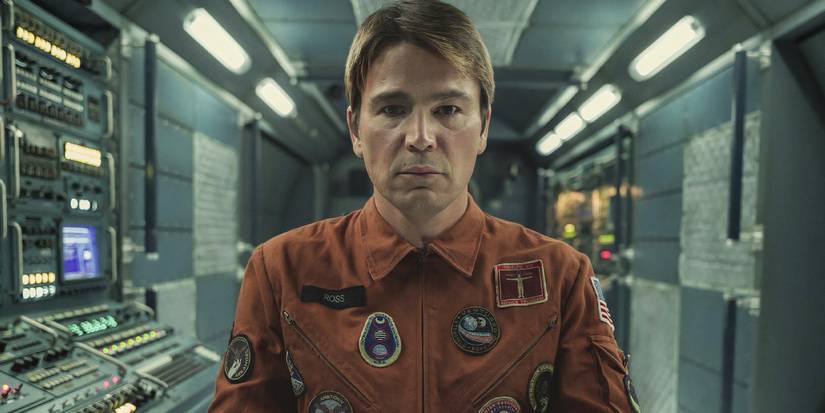 Josh Hartnett stares into the camera blankly while in a spacecraft 