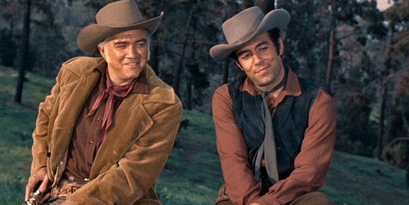 Ben (Lorne Greene) and Adam Cartwright (Pernell Roberts) on horseback on 'Bonanza'