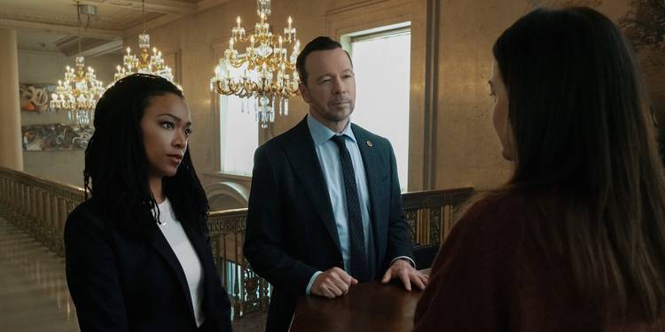 Boston Blue - Danny Reagan (Donnie Wahlberg) and Lena Silver (Sonequa Martin-Green) question a hotel worker