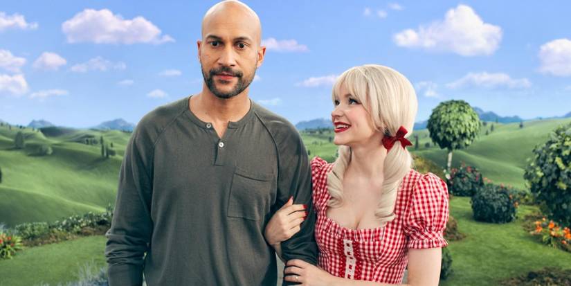 Dove Cameron memegang lengan Keegan-Michael Key di 'Schmigadoon'