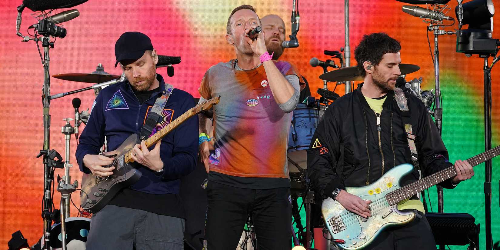 Coldplay performing on stage