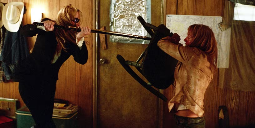 Two women fight each other with made up weapons