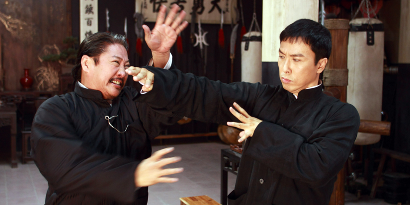 Two men fight each other