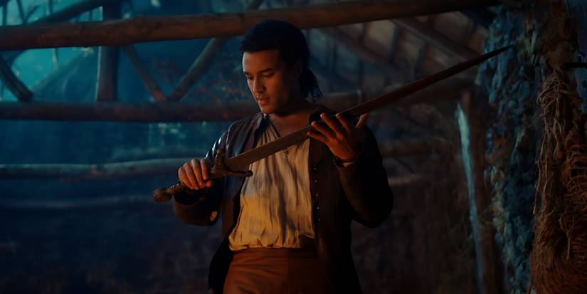 Arthur (Devon Terrell) holds a sword in Cursed