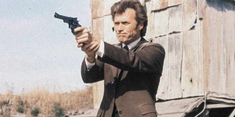 Clint Eastwood as Inspector Harry Callahan holding and pointing a gun in Dirty Harry (1971)