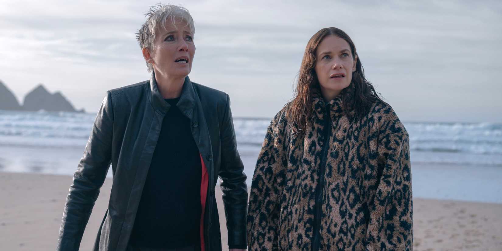 Ruth Wilson as Sarah and Emma Thompson as Zoe standing in front of the ocean in Down Cemetery Road.