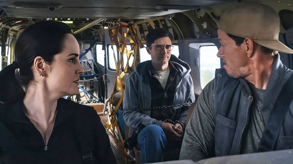 Michelle Dockery, Topher Grace, and Mark Wahlberg in Flight Risk.