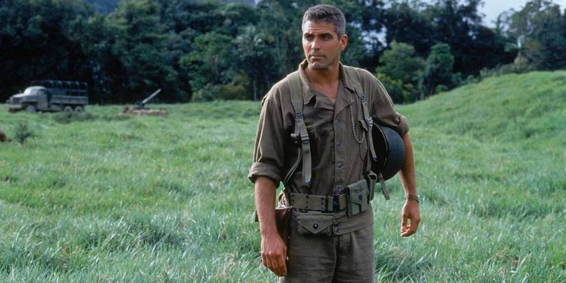 George Clooney stands in a field in 'The Thin Red Line' (1998).