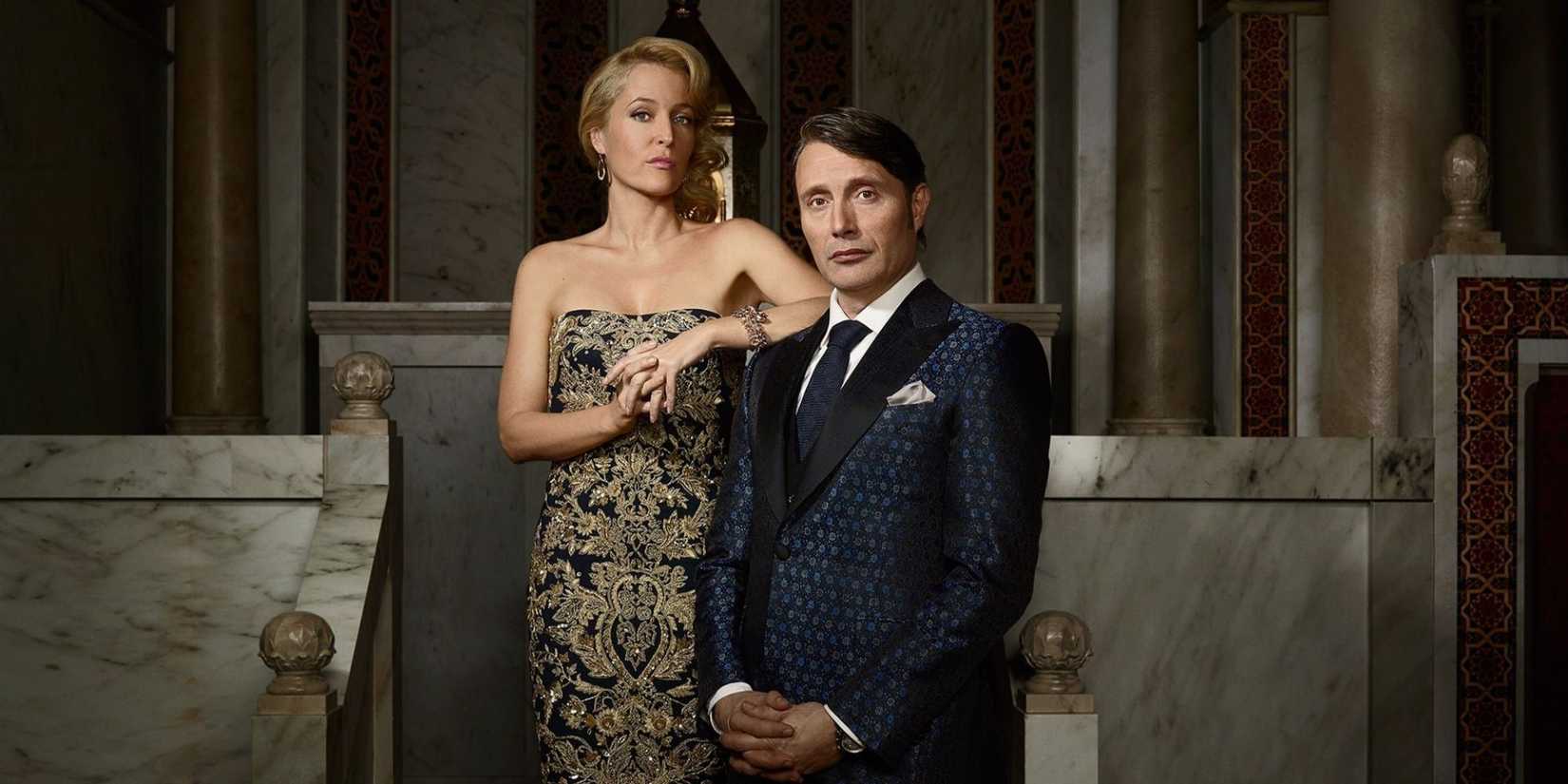 Gillian Anderson and Mads Mikkelsen in formal attire look dramatically at the camera in Hannibal.