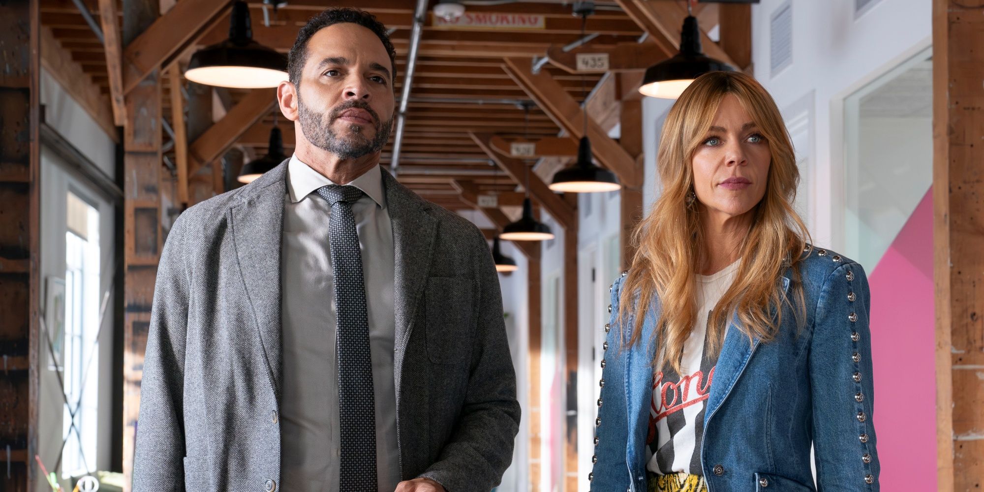 Daniel Sunjata as Karadec standing next to Kaitlin Olson as Morgan Guillory while on a case in High Potential