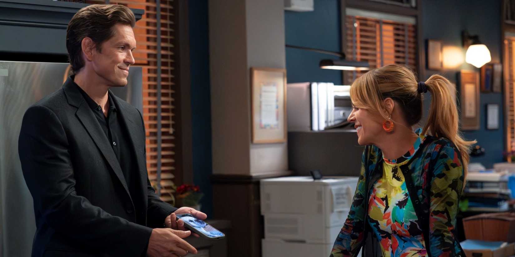 Kaitlin Olson as Morgan Guillory smiling across from Steve Howey as Captain Wagner in High Potential