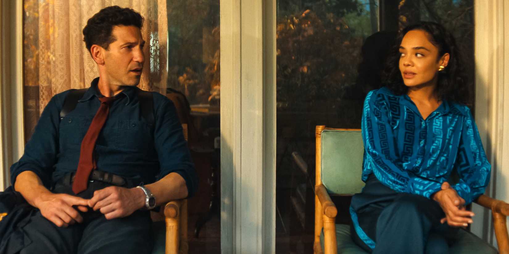 Jon Bernthal as Detective Jack Harper sitting next to Tessa Thompson as Anna Andrews in His & Hers