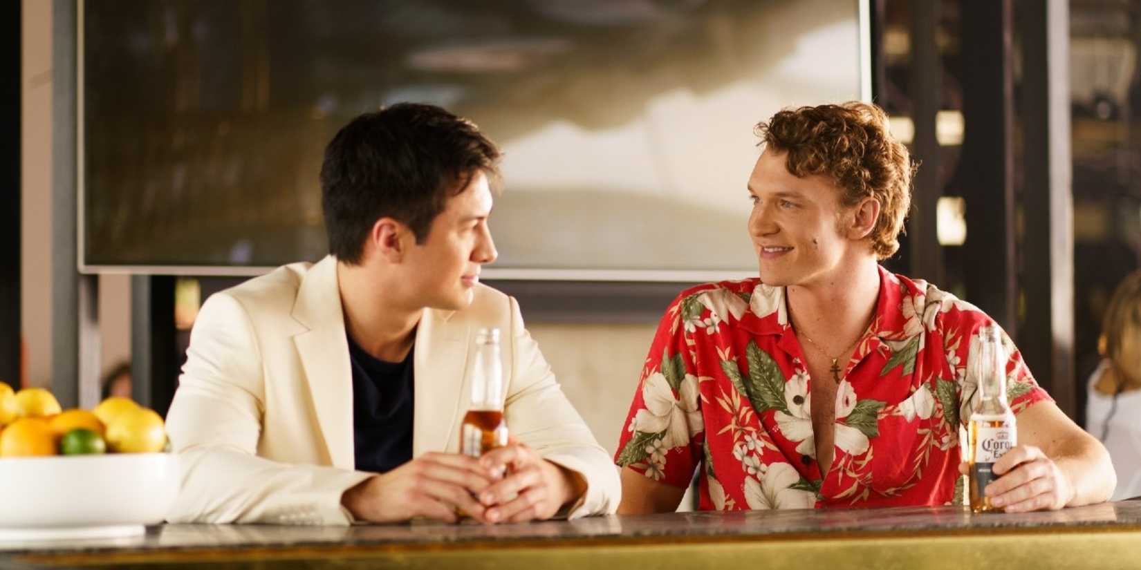 Shane Hollander and Ilya Rozanov sitting at a bar together in Heated Rivalry Season 1, Episode 5.