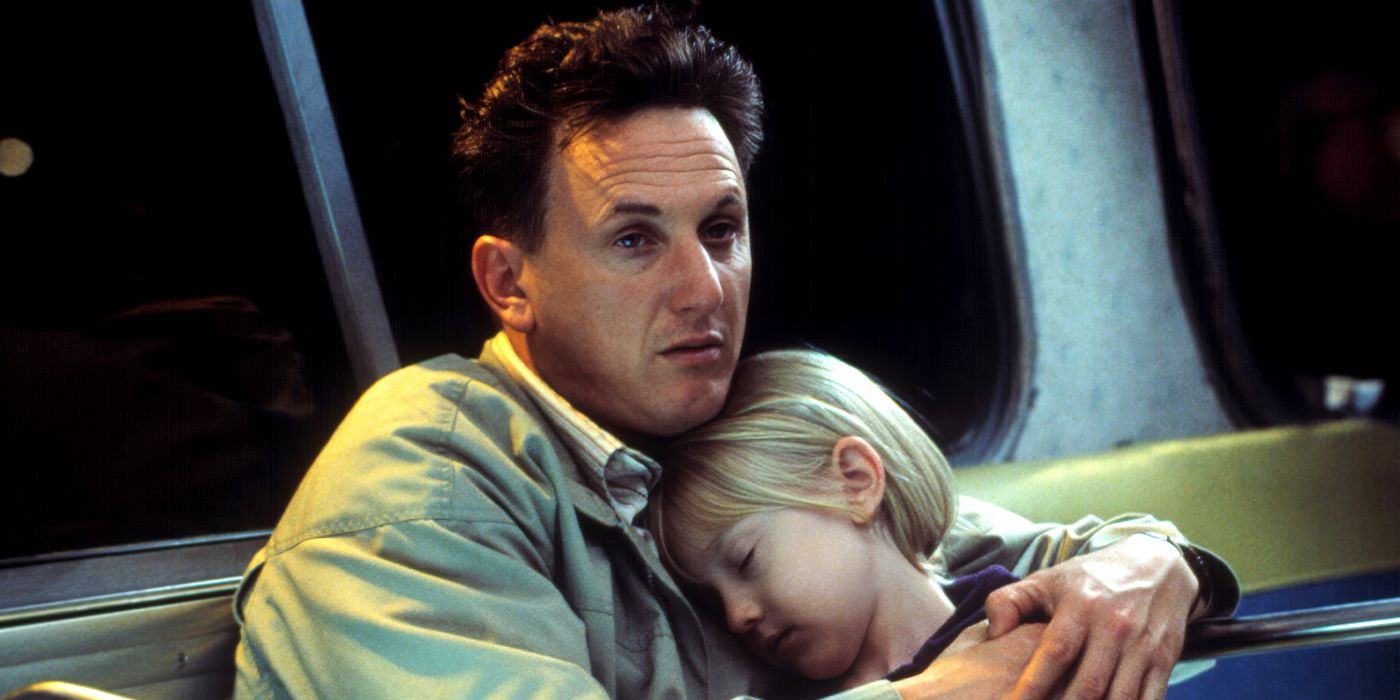 Sam in a bus embracing a sleeping Lucy in I Am Sam