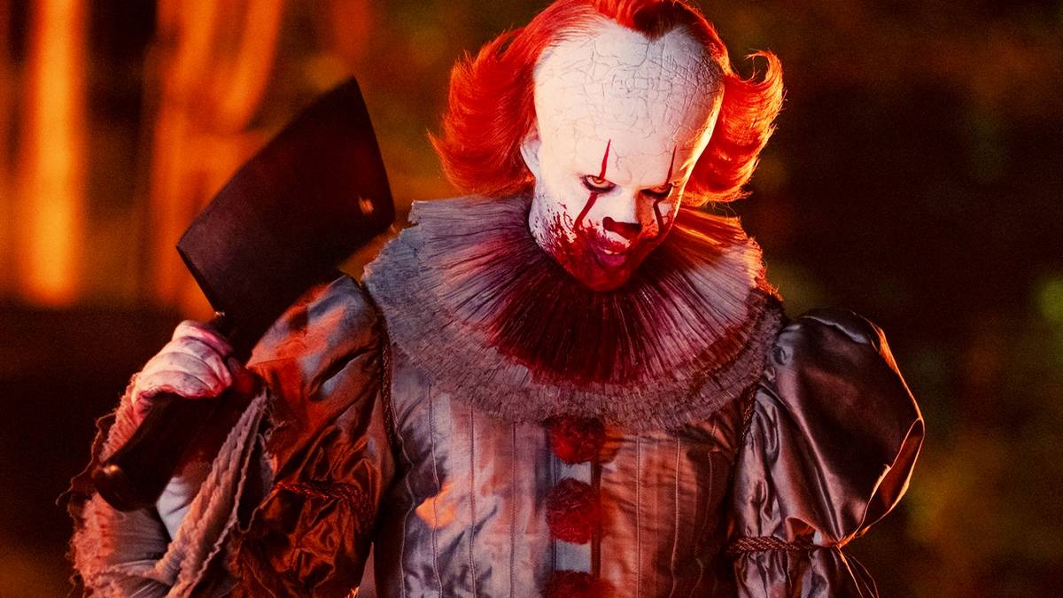 Bill Skarsgård's bloodied Pennywise with a meat cleaver in IT: Welcome to Derry