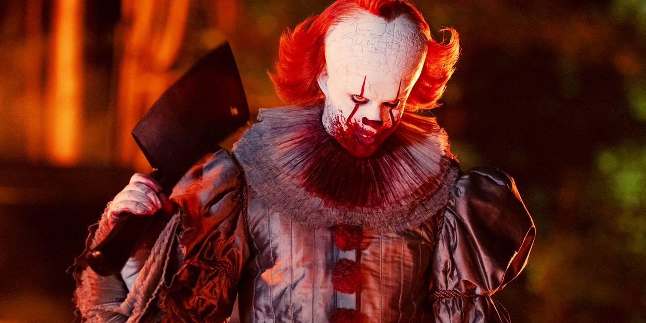 Bill Skarsgård's bloodied Pennywise with a meat cleaver in IT: Welcome to Derry
