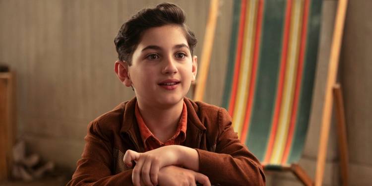 Arian S. Cartaya as Rich sitting in a chair and looking hopeful in IT: Welcome to Derry
