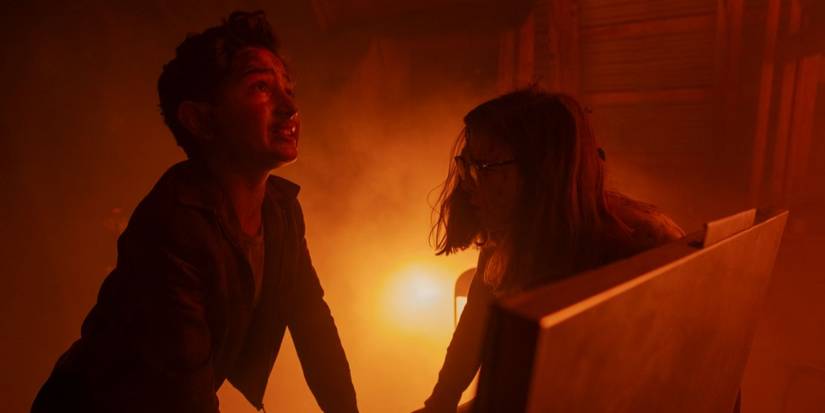 Rich (Arian S. Cartaya) and Marge (Matilda) trying to hide during a fire in 'IT: Welcome to Derry'