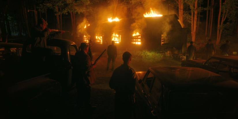 A mob watches the Black Spot burn in 'IT: Welcome to Derry'