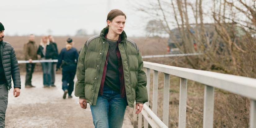 Dani walking forward with a stern expression in Land of Sin