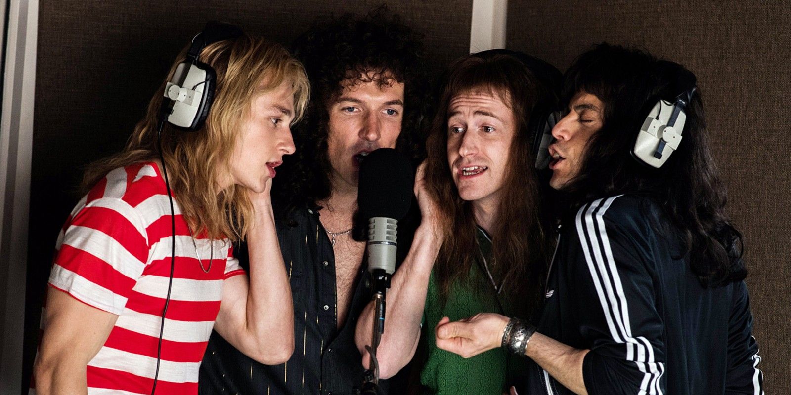Queen recording around a mic and wearing headphones in Bohemian Rhapsody
