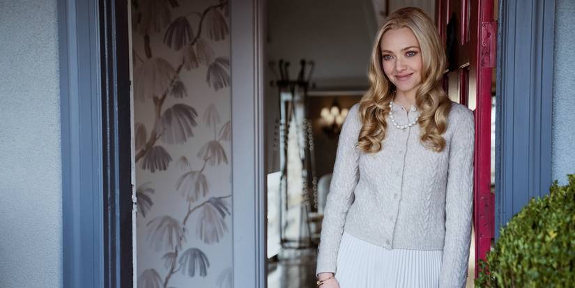 Amanda Seyfried smiling in the doorway in The Housemaid