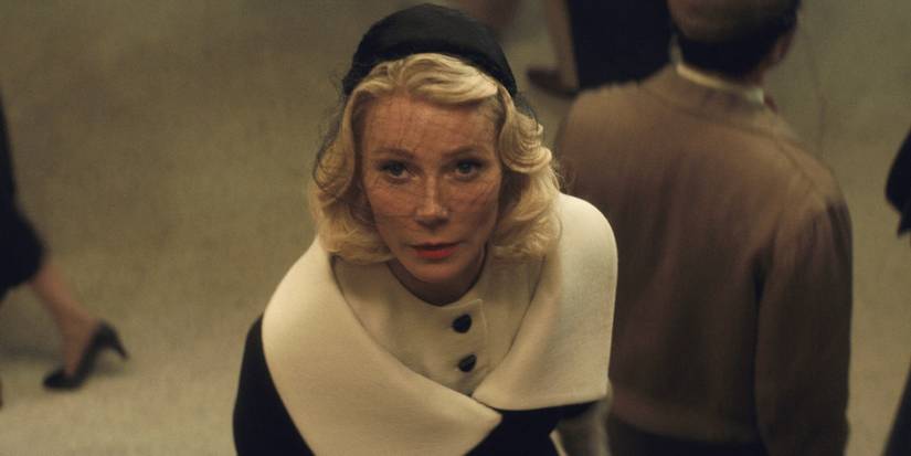 Gwyneth Paltrow looking up a staircase in Marty Supreme