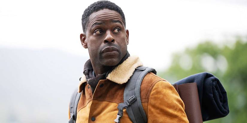 Xavier looking over his shoulder in a jacket and backpack in Paradise Season 2.