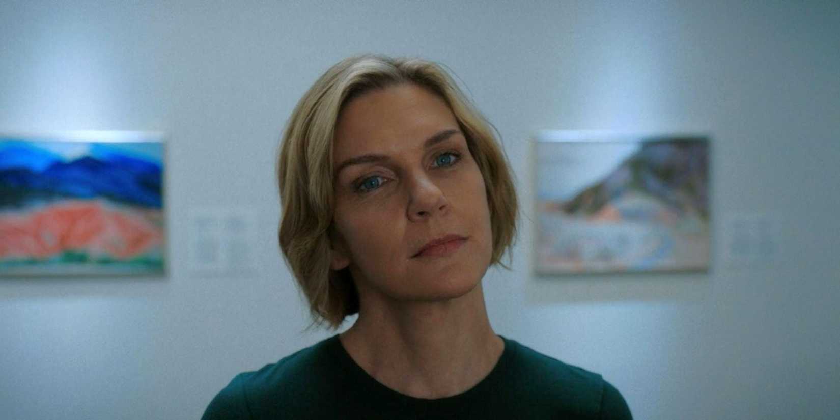 Carol (Rhea Seehorn) stands in a museum in Pluribus.