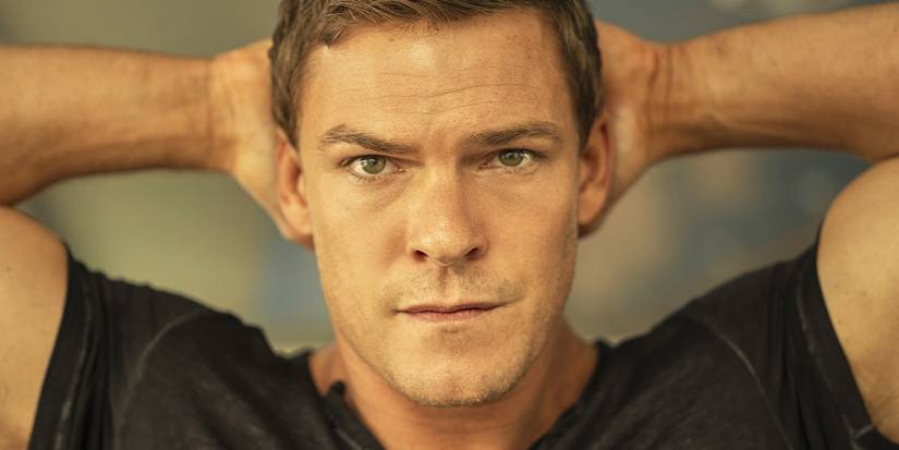 Reacher's Alan Ritchson with his hands behind his head