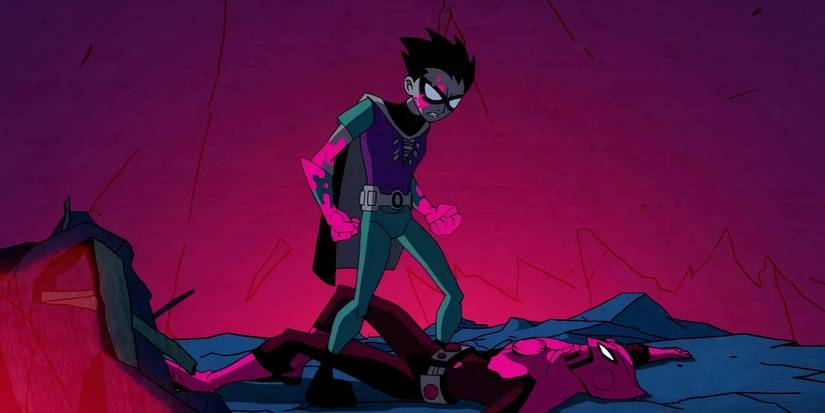 Robin standing over a villain, bloody-fisted, in Teen Titans: Trouble in Tokyo