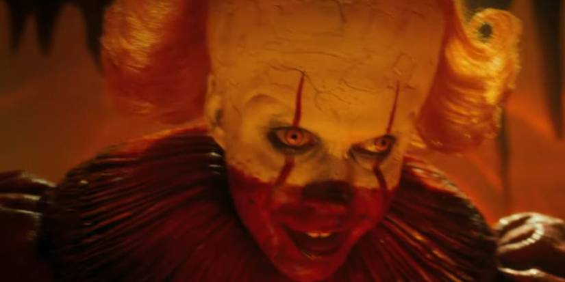 Pennywise (Bill Skarsgard) with a red lower face in 'IT: Welcome to Derry'