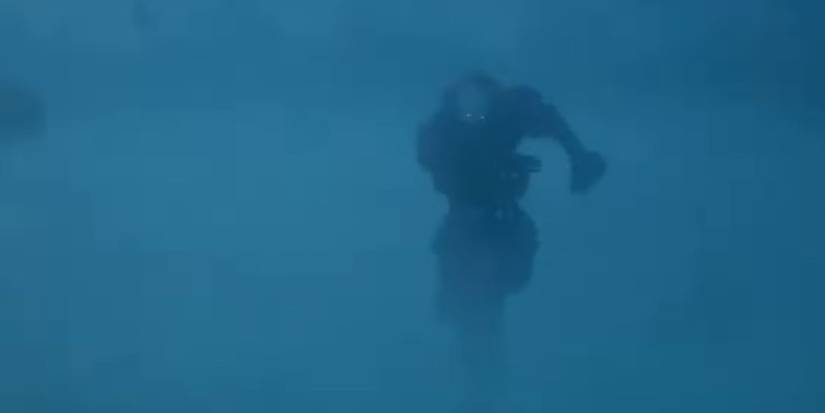 Pennywise (Bill Skarsgard) running through the fog in 'IT: Welcome to Derry'
