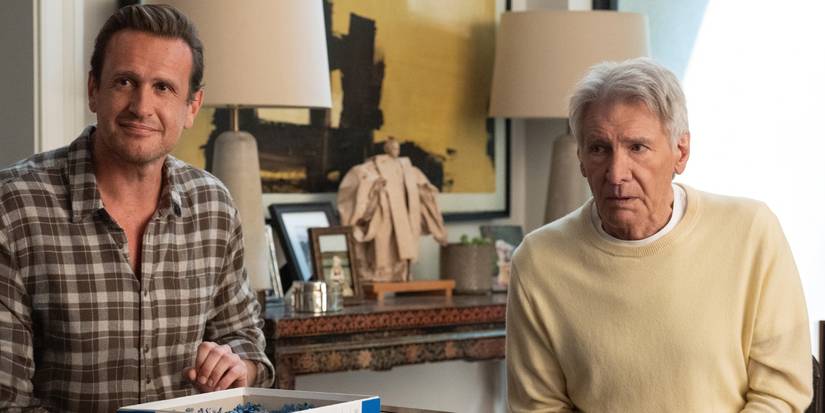 Jason Segal as Jimmy sitting near Harrison Ford as Paul with a puzzle in Season 3 of Shrinking.