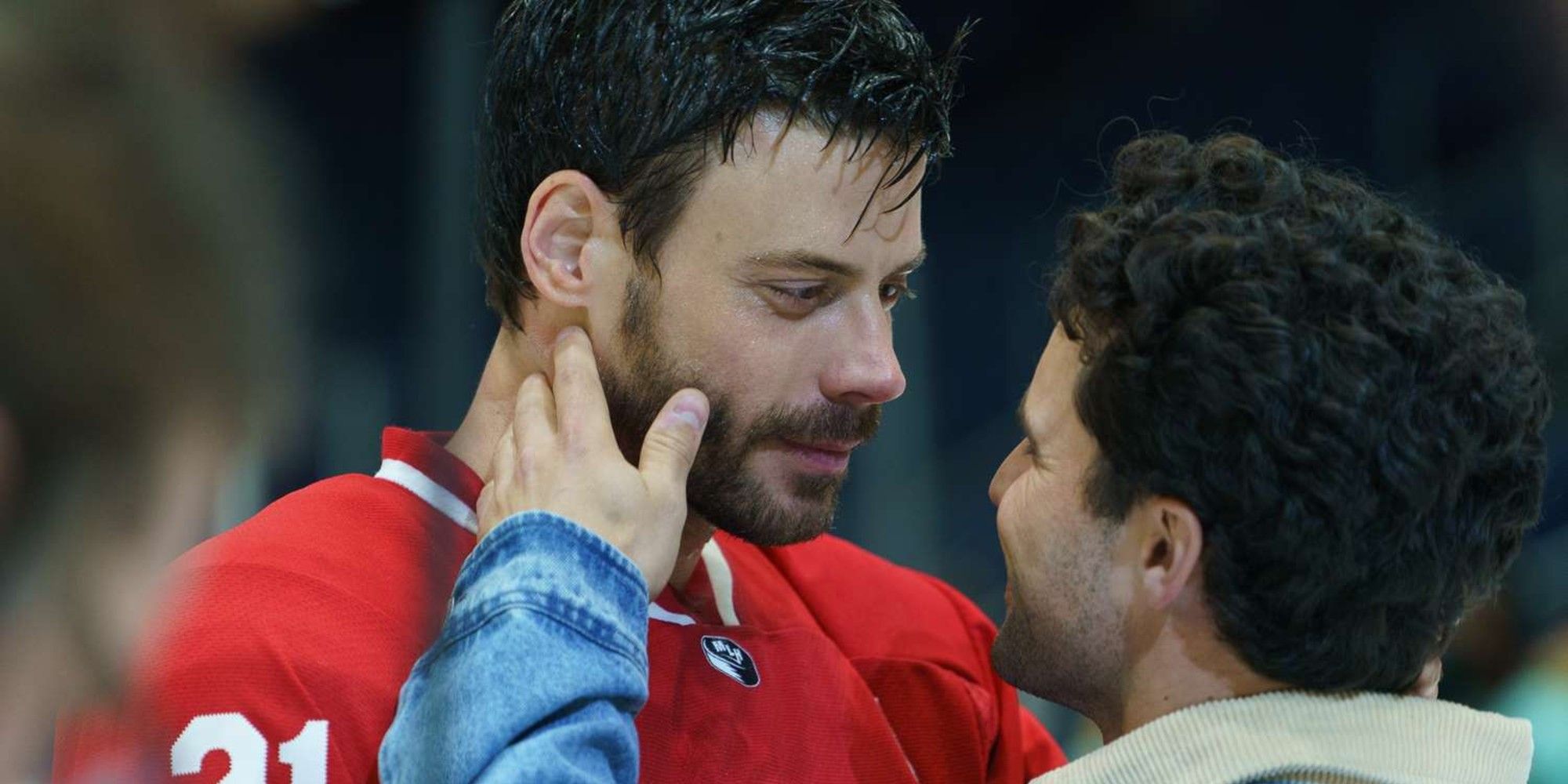 Scott Hunter and Kip Grady embracing publicly in Heated Rivalry Episode 5.