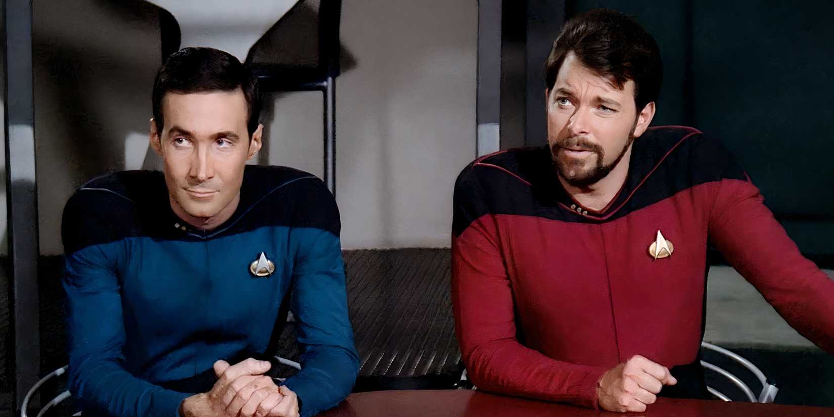 Bruce Maddox and Riker sitting side by side in Star Trek: The Next Generation's The Measure of a Man