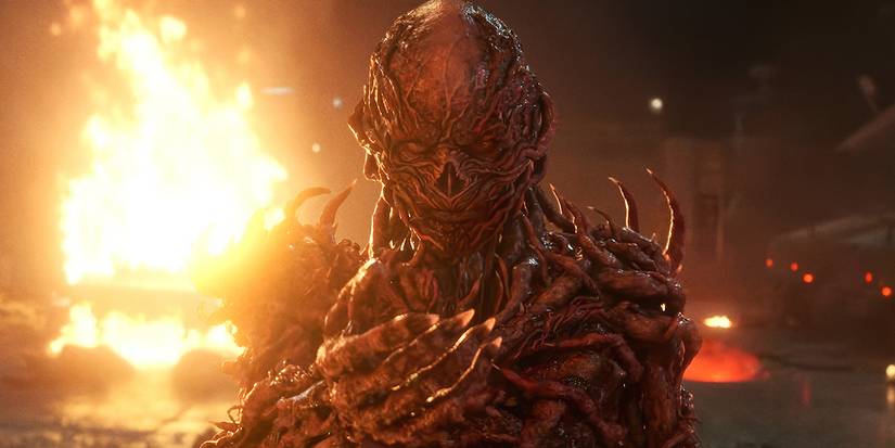 Vecna with a hand out toward the camera with fire behind in 'Stranger Things 5.'