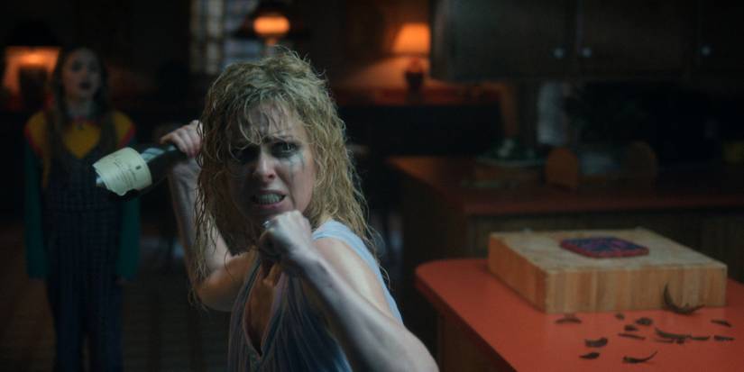 Cara Buono as Karen Wheeler fights a Demogorgon on 'Stranger Things' Season 5.