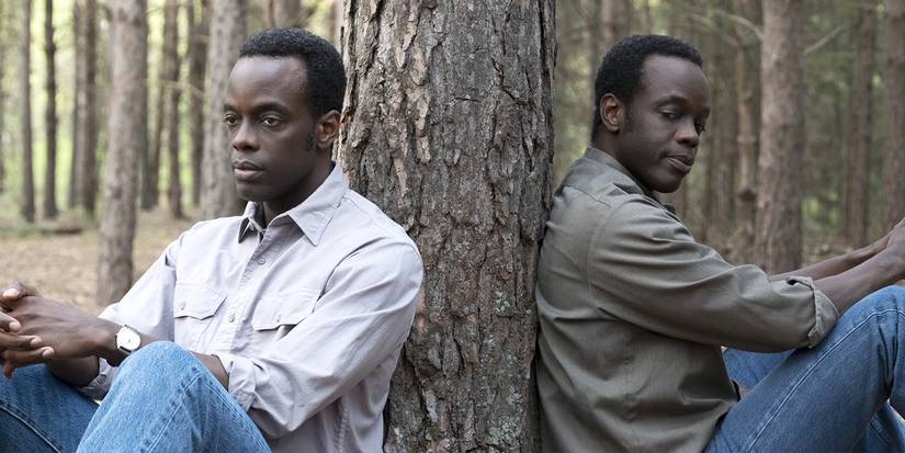 Ato Essandoh leans against a tree in Tales from the Loop