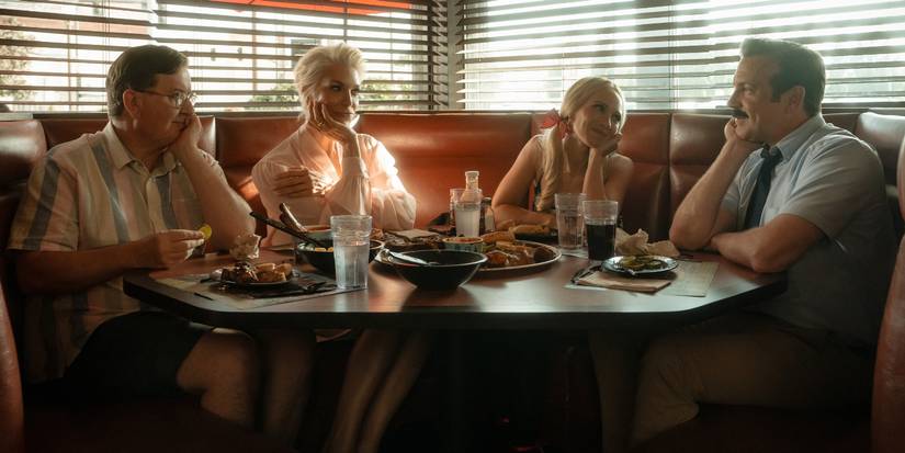 Jeremy Swift as Leslie Higgins, Hannah Waddingham as Rebecca Welton, Juno Temple as Keeley Jones, and Jason Sudeikis as Ted Lasso in a diner on 'Ted Lasso' Season 4.