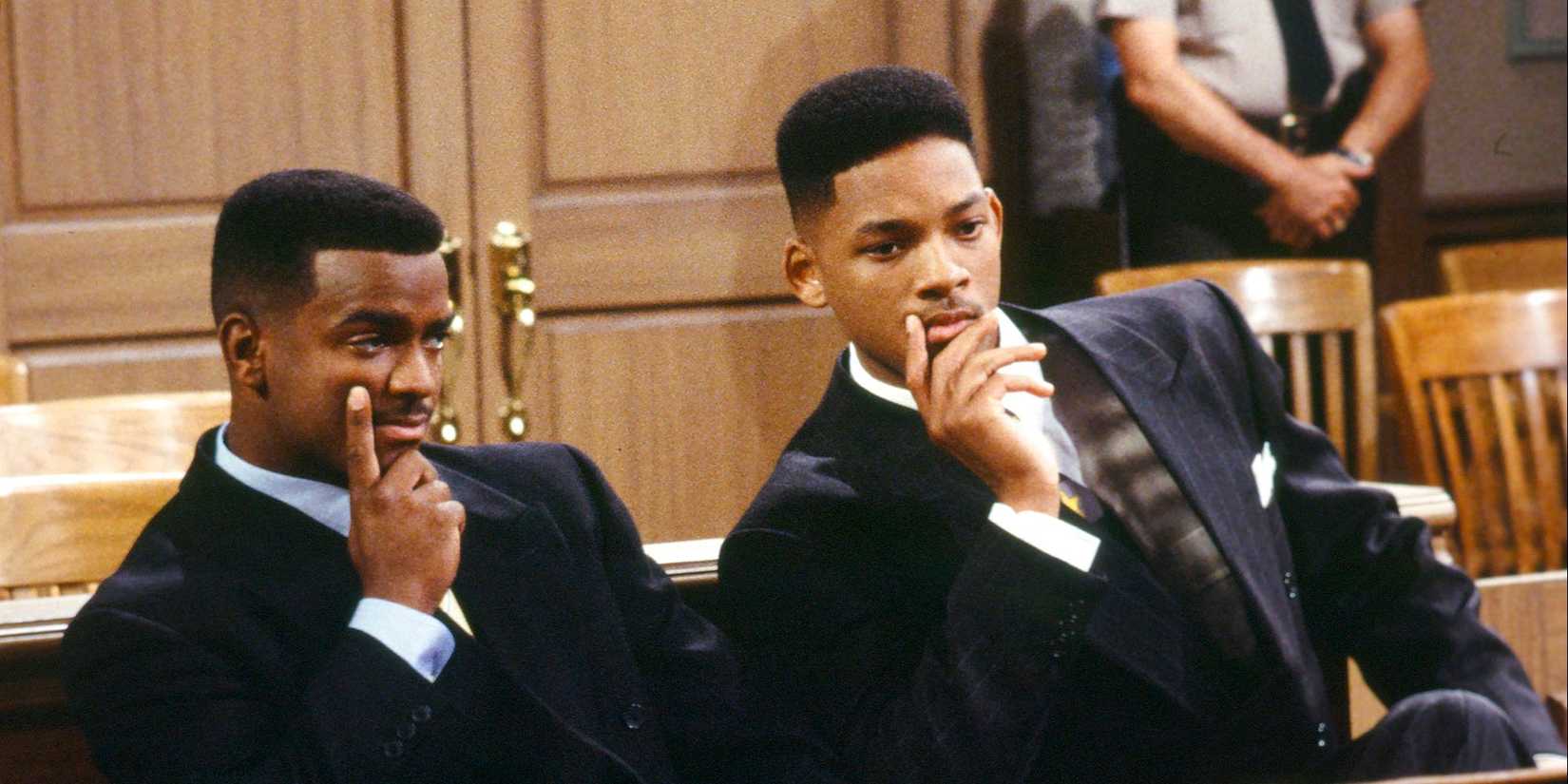 Will Smith and Alfonso Ribeiro sit in court in a contemplative pose in The Fresh Prince of Bel-Air.