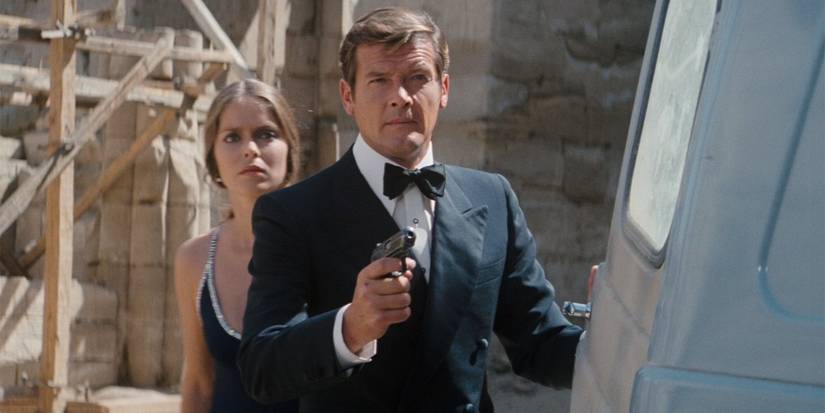 Roger Moore with a gun and a girl behind him in The Spy Who Loved Me