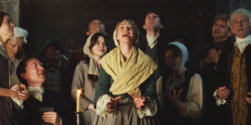 Ann Lee crying, surrounded by her followers who are crying with her.