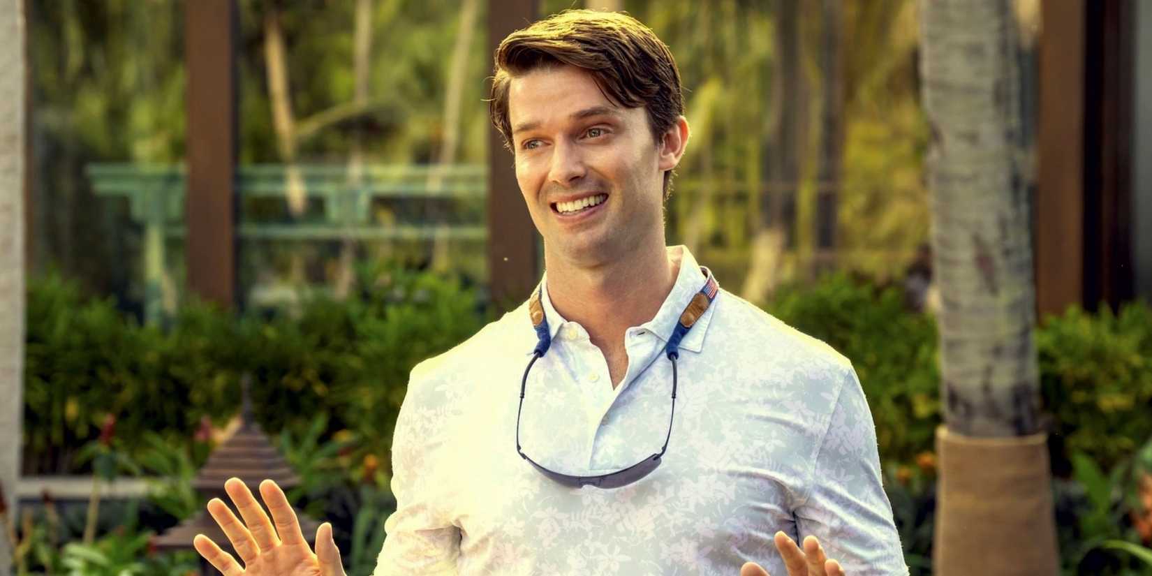 Patrick Schwarzenegger as Saxon Ratliff outside with his hands up in Season 3 of The White Lotus.