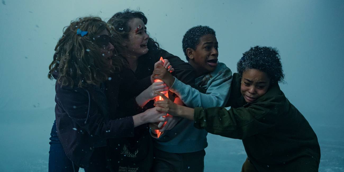 Matilda Lawler, Clara Stack, Blake Cameron James and Amanda Christine hold a dagger in IT: Welcome to Derry