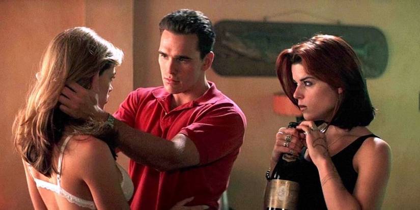 Neve Cambpell, Matt Dillon, and Denise Richards as Suzie, Sam, and Kelly looking at each other in Wild Things.