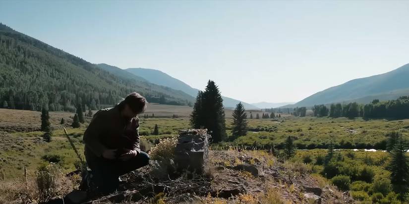 Kayce Dutton (Luke Grimes) kneels beside a grave on 'Y: Marshals'